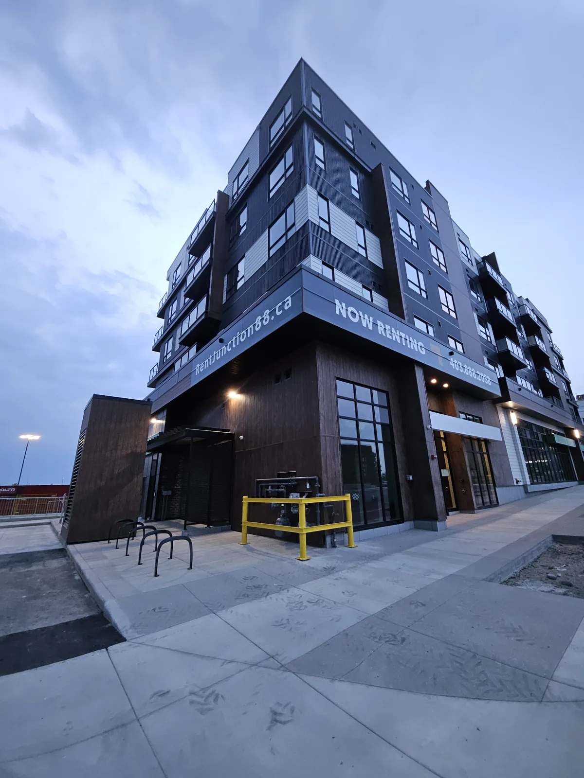 Junction 88 building graphic installation Calgary — dusk wide angle showing full scale